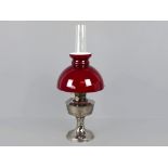 Alladin oil lamp, no. 23, with original ruby red glass shade and chimney, 24" tall