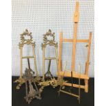 Early 20th Century Janis no.55 brass easel, 12" high; together with a carved wooden easel 9" high,