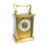 Small carriage clock timepiece, the 1.75" cream chapter ring within a gilt mask and corniche brass