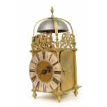 Interesting English brass hook and spike lantern clock, signed Roger Moor, Ipswich to the foliate