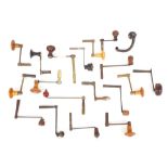 Quantity of various crank handle winding keys some with turned wooden handles (over twenty)