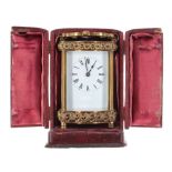 Carriage clock timepiece, within a Doucine style case with C-scroll bands, 6.5" high; also with a