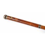 Rare malacca walking cane fitted with a circular aperture displaying a small watch and inscribed