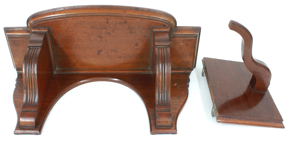 Good mahogany clock bracket, the breakfront moulded stepped top over shaped fluted supports, 21.5"