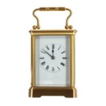 Small French carriage clock striking on a gong, within a corniche brass case, 5.5" high (key and