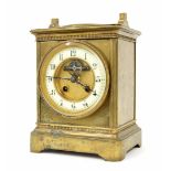 French brass two train mantel clock striking on a gong, the 3.75" cream chapter ring enclosing a