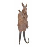 Rare Black Forest novelty musical wall rack modelled as a hunting hare with rifle, with musical