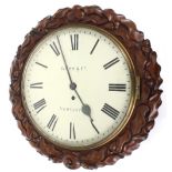 Mahogany single fusee 12" wall dial clock signed Kuss & Co, Newcastle, within a carved foliate