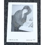 Ronnie Wood - autographed limited edition photograph page, signed by Ronnie Wood in gold pen, 11.25"