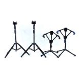 Two Starfish Plus Active hanger guitar stands; together with two Catch-o-Matic guitar stands (4)