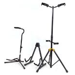 Hercules two-way guitar stand; together with two further guitar stands (3)