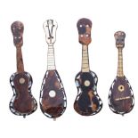 Two miniature tortoiseshell and mother of pearl inlaid Neapolitan mandolins; also two similar