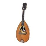Interesting early 20th century Italian Neapolitan mandolin, the sound hole formed with a woman