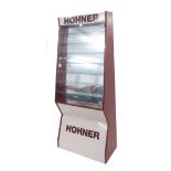 Vintage Hohner harmonica shop display cabinet, with Perspex shelves and front, mirror back, 63.5"