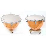 Pair of Premier hand tuned copper timpani drums, 28" and 25", each fitted upon wooden trolley