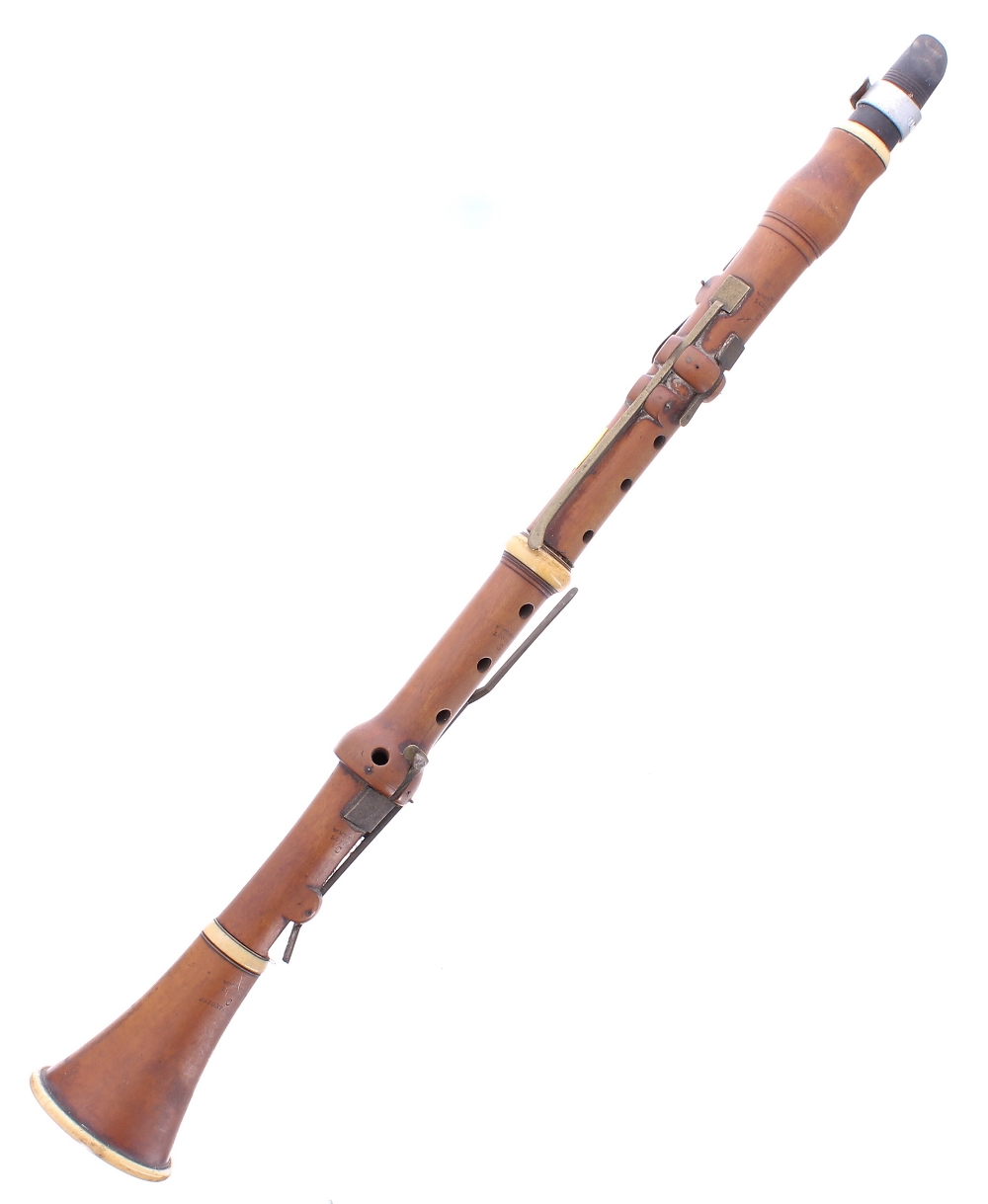 Boxwood and ivory clarinet by and stamped W. Milhouse, London, 337 Oxford St (C), with six square
