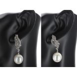 Attractive pair of 18k white gold diamond and south sea pearl drop earrings, round brilliant-cuts,