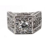 Impressive white gold diamond set gentleman's ring, with a good quality central round brilliant-