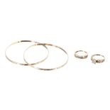 Two yellow gold bangles, stamped 14ct, 12.4gm; two stone set rings marked 18k, 5.7gm (4) (224)