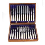 Oak boxed set of silver plated and mother of pearl knives and forks, retailed by Fattorini & Sons,