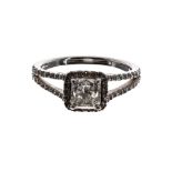 Attractive platinum diamond set ring, halo set with modified cushion-cut diamond and two-row split