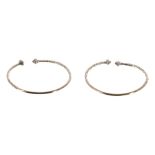Two yellow metal patterned torque bangles, 28gm (2) (251)