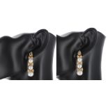 Good pair of yellow gold cultured pearl and diamond drop earrings, each with single pear shaped