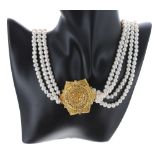 Freshwater multi-strand pearl necklace with yellow metal flower pendant and clasp, 150.2gm, the