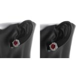 Pair of 18ct white gold treated ruby and diamond cluster studs