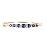 Early 20th century certified natural corundum blue sapphire and diamond hinged bangle, with seven