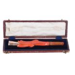 Victorian gold, pink coral and amber cheroot holder carved as a mythical fish, 13.8gm, 4.25" long,