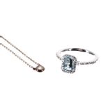(223) Modern 18ct white gold aquamarine set ring with diamond halo surround, the aquamarine 0.87ct