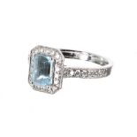 18ct white gold aquamarine and diamond halo set ring, the aquamarine 0.74ct approx, cluster 11mm x