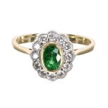 18ct green garnet and diamond oval cluster ring, the garnet 0.82ct approx in a setting of round