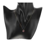 Ruby and diamond 9ct pendant on chain, the pendant 10mm diameter, 1.4gm