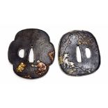 Two Japanese bronze Tsubas, both with silvered and gilt highlighted decoration, one Mokko Gata form,