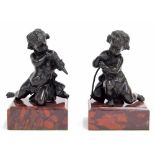 Good pair of bronze cherubs, each modelled kneeling upon rouge marble socles, 7" high (2)