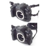 Two Konica Minolta Dynax 7D DSLR camera bodies (2)