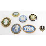 Collection of seven Wedgwood and other Jasperware type brooches, largest 2.75" wide (7)