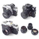 Minolta XE-1 camera; together with a Minolta XG1 and Minolta XM. also assorted lenses and