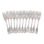 Twelve George IV Irish silver dinner forks, crested finials underside, ten by William Cummins,