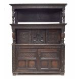 Rare Charles II oak canopy court cupboard, Yorkshire, circa 1660, the raised panelled canopy back