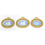 Three framed Wedgwood Jasperware oval miniature plaques in ornate giltwood frames, each depicting