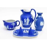 Wedgwood Jasperware items to include a a small vase, two jugs (tallest 5.5" high) and a ring stand/