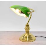 Vintage style brass desk lamp with a green opaque glass swivel shade, 14.5" high