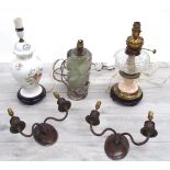 Three table lamps; a converted brass and porcelain oil lamp, one bubble inclusion glass and one