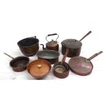 Selection of antique brass and copper pans; also a kettle, the largest pan with swing handle 13"