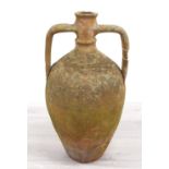 Primitive terracotta amphora jar, with twin handles and incised decoration, 22" high
