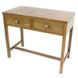 Oak side table with two drawers upon square supports united by a stretcher, 39" wide, 19.75" deep,