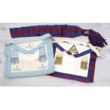 Masonic regalia including two aprons, one with matching burgundy/navy sash (3)